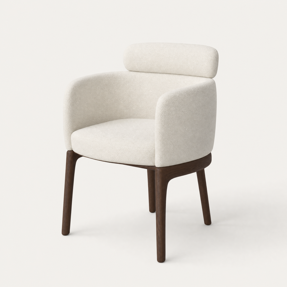 ACERKA Miami presents the Sia Dining Chair by Ramón Esteve, featuring a fully upholstered wraparound shell, floating lumbarcushion, and slender Dark Oak legs.