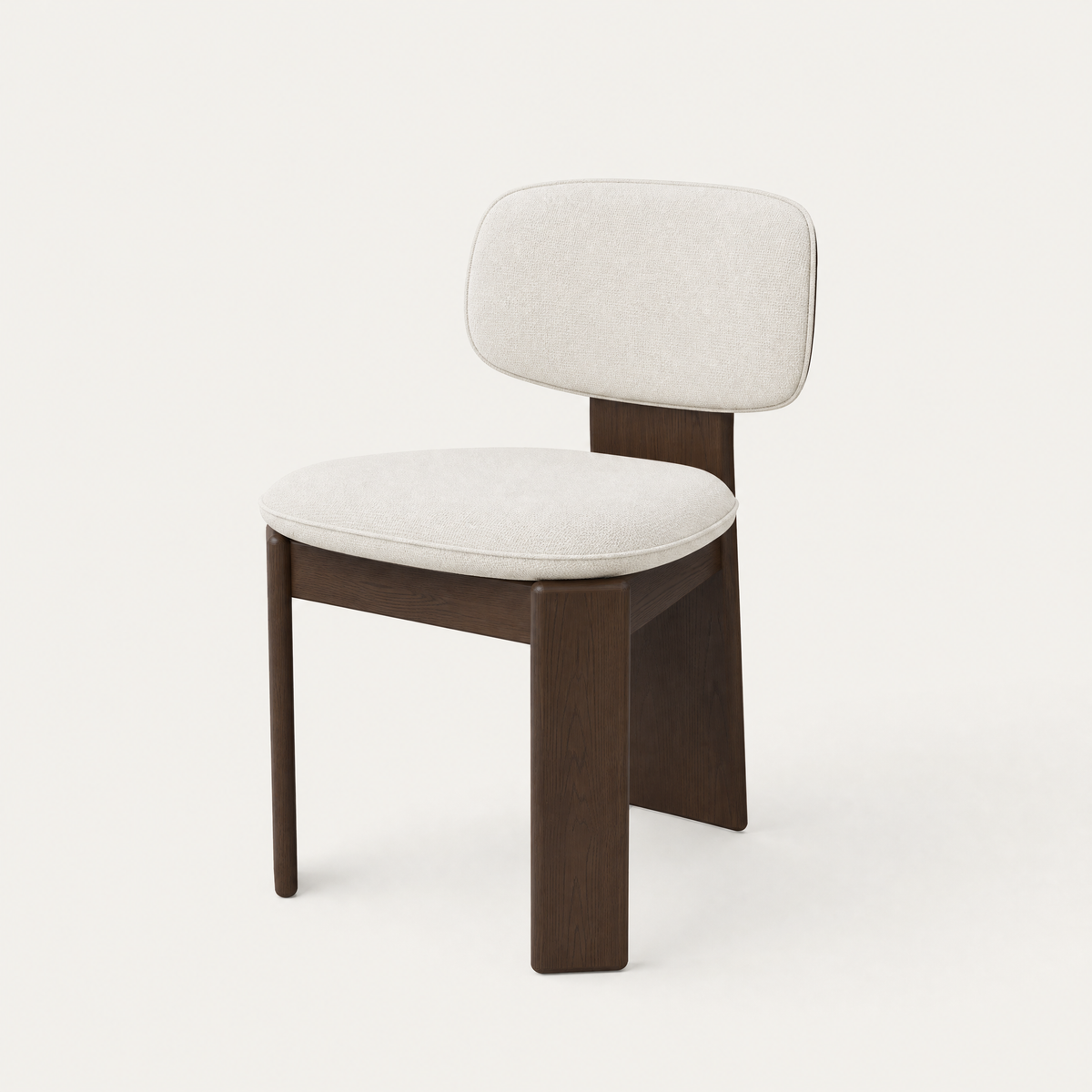 ACERKA Miami presents the Gaba Dining Chair by Valerio Sommella, featuring a gently curved upholstered backrest and architectural solid Dark Oak frame.