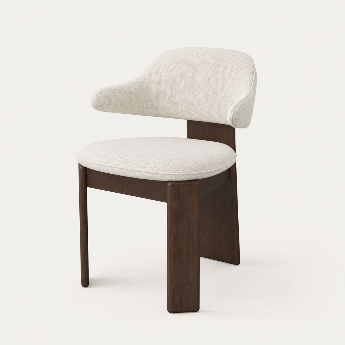 ACERKA Miami presents the Gaba Dining Armchair by Valerio Sommella, featuring a softly curved upholstered backrest, generous seat, and sculptural Dark Oak frame.