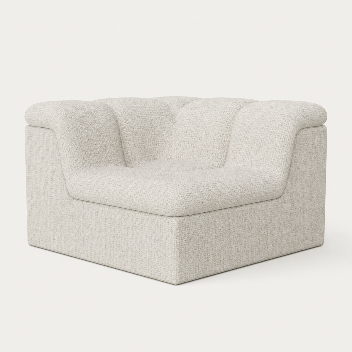 A modern low-profile accent chair upholstered in a textured light beige fabric, featuring a tufted backrest and rounded arms, shown against a plain white background. Designed by Valerio Somella for Acerka