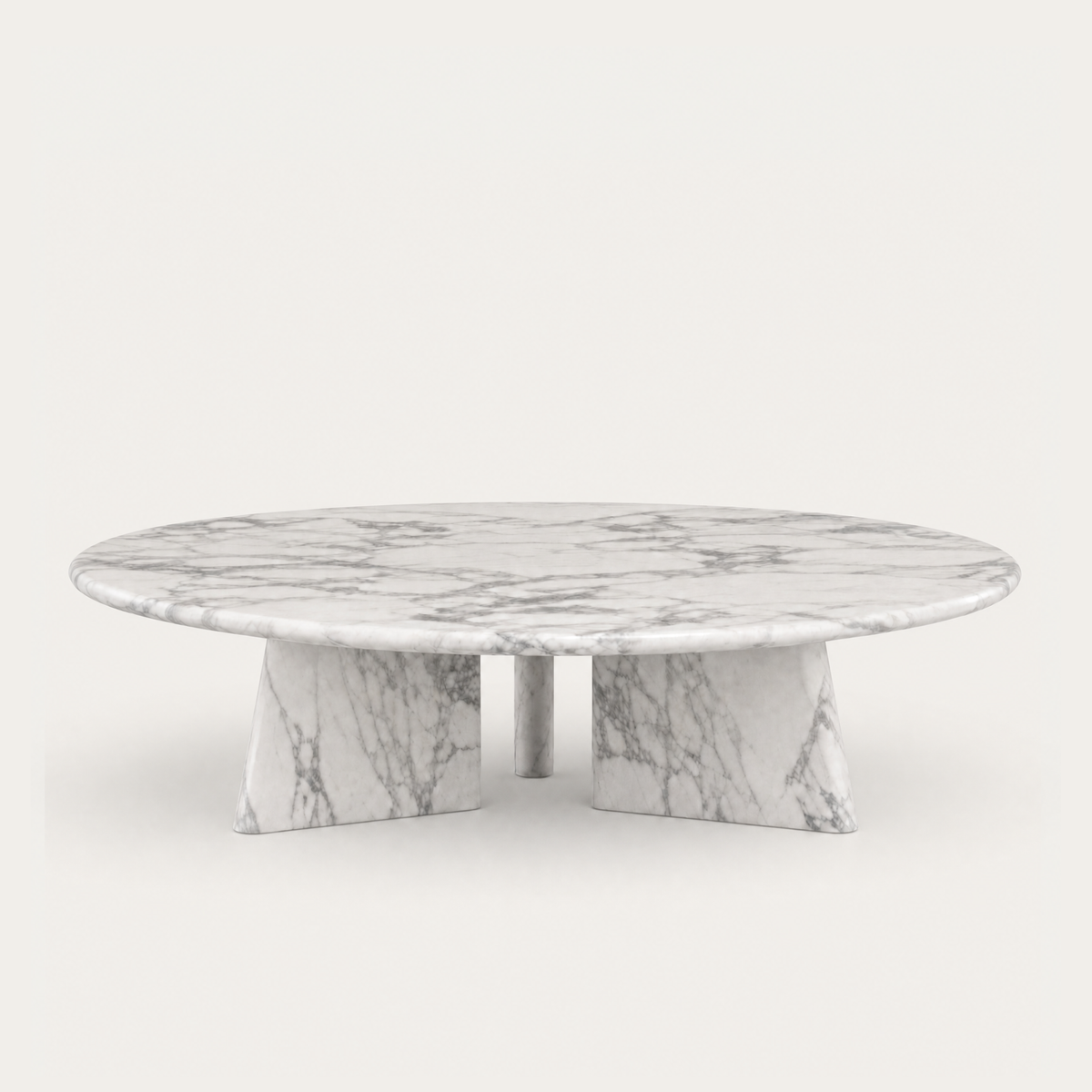 The Cabo Coffee Table by Francesco Meda features a circular Arabescato marble top with bold natural veining and a distinctive architectural base for ACERKA Miami.
