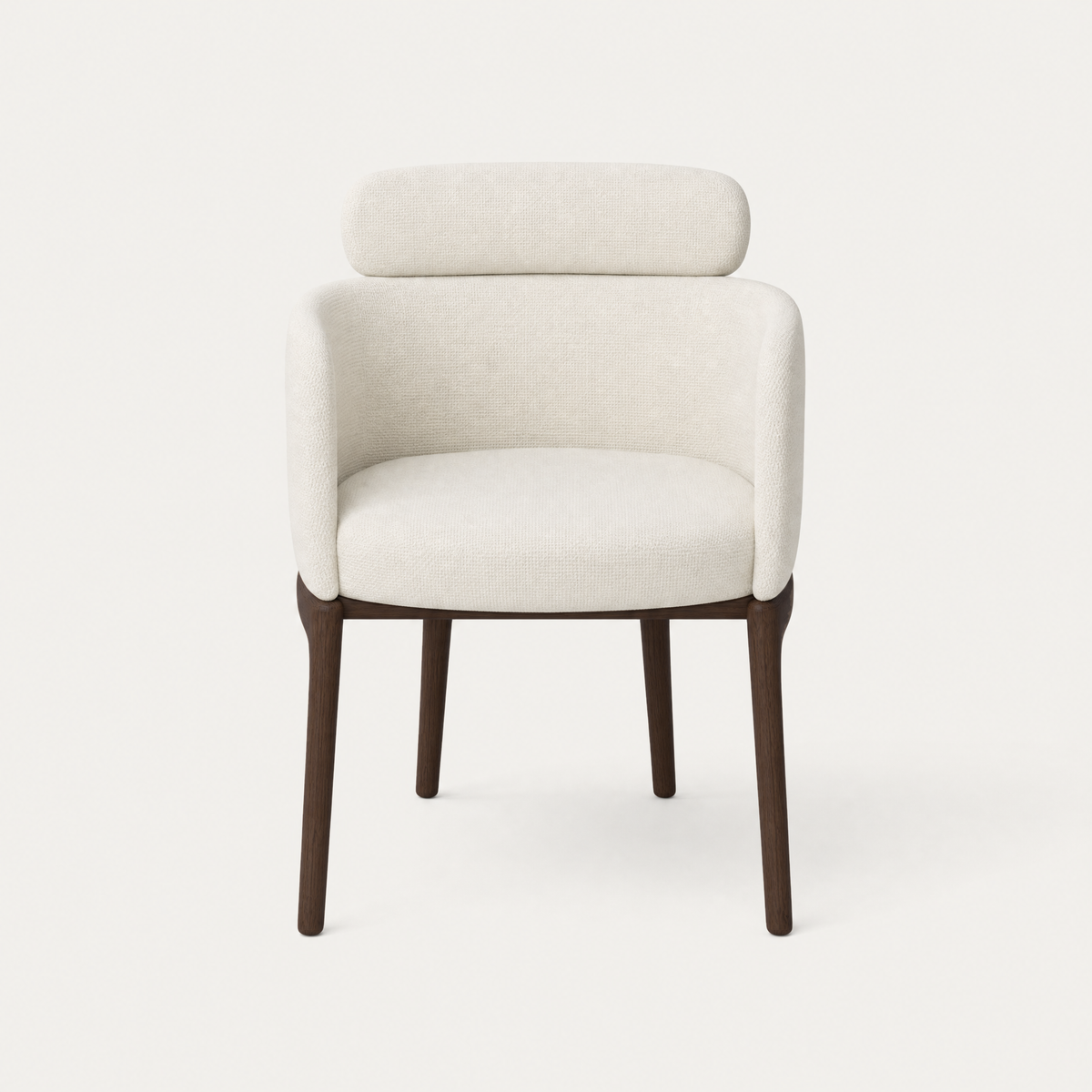 The Sia Dining Chair by Ramón Esteve pairs an enveloping upholstered silhouette with FSC-certified solid oak legs, available at ACERKA Miami.
