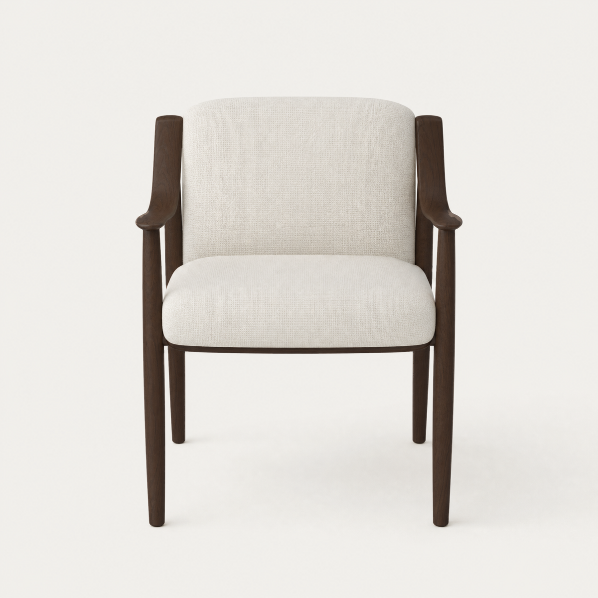 The Tibeto Dining Chair by Ramón Esteve contrasts a carved Dark Oak structure with a softly rounded upholstered interior, available at ACERKA Miami.
