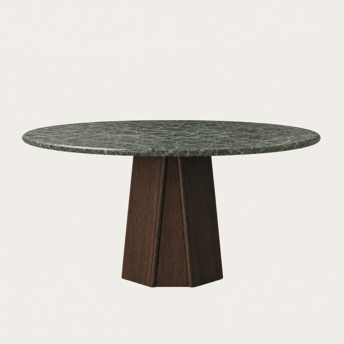 ACERKA Miami presents the Chuli Round Dining Table by Valerio Sommella, pairing deep green Verde Alpi marble with a sculptural faceted oak base.