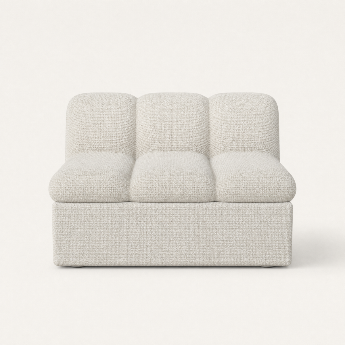 A modern low-profile accent chair upholstered in a textured white fabric, featuring a three-segmented backrest and rounded armrests, set against a plain off-white background. Designed by Valerio Sommella for Acerka.