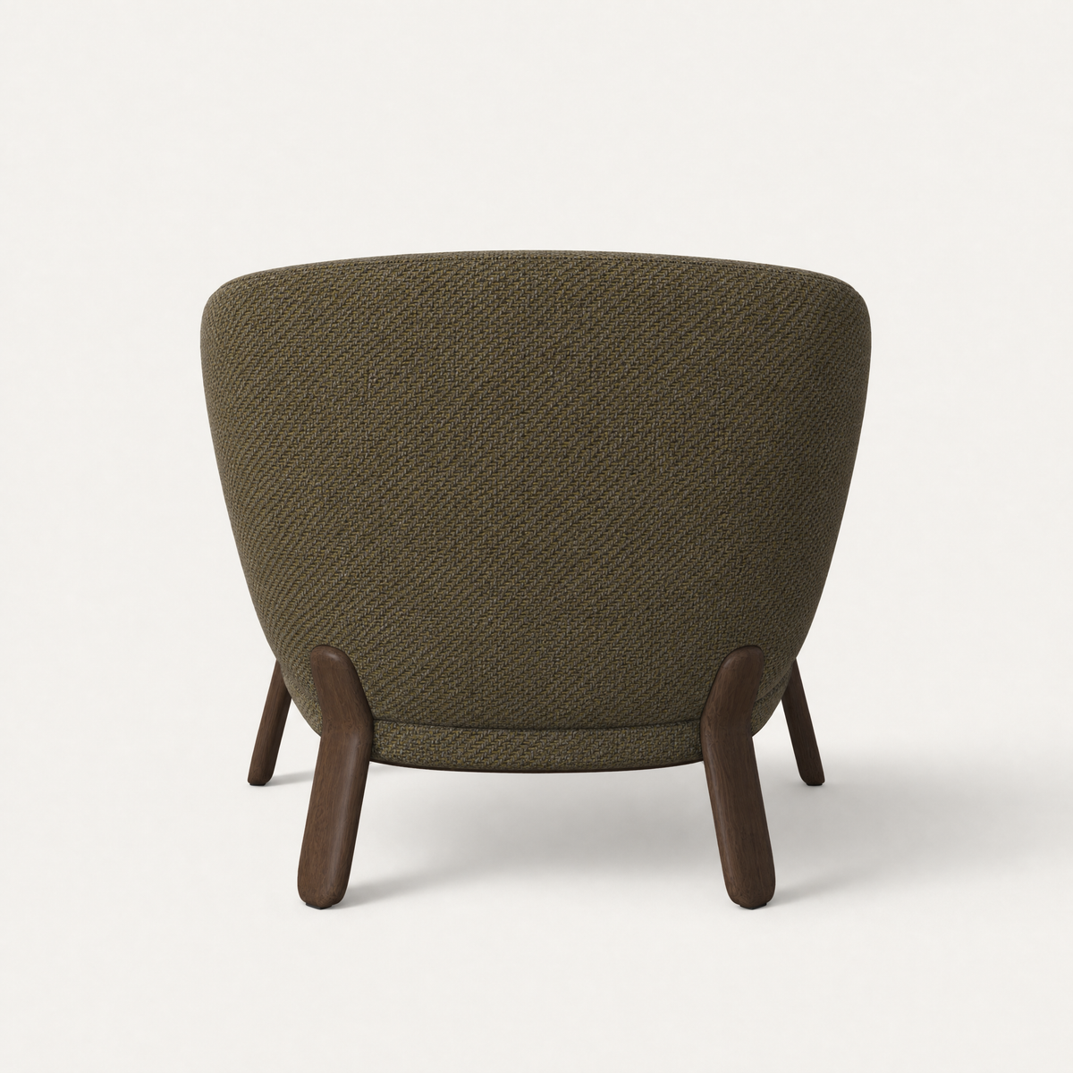 The Lifa Accent Chair at ACERKA Miami features Ramón Esteve’s distinctive wraparound backrest, supported by a beautifully crafted solid natural oak frame.