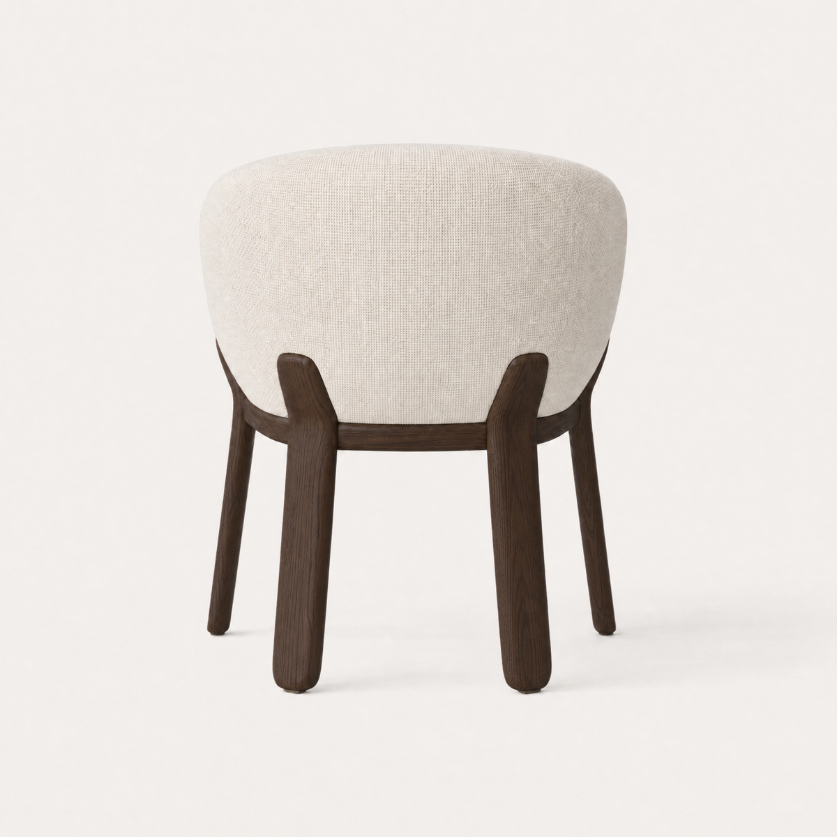 A sculpted solid oak frame supports the softly upholstered seat of the Lifa Dining Chair by Ramón Esteve, presented by ACERKA Miami.
