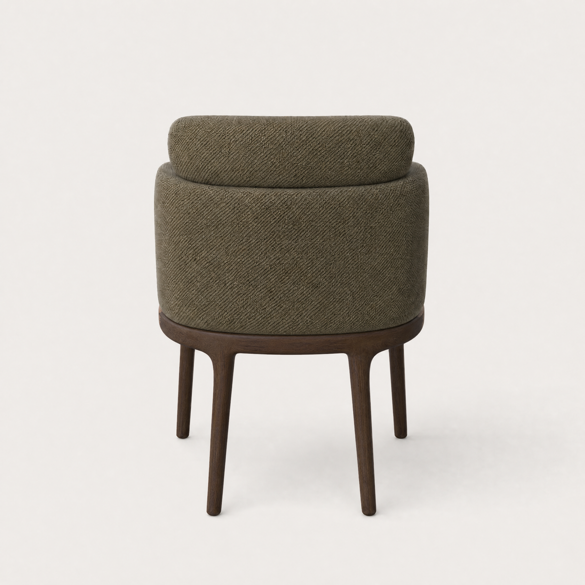 Designed with a generously cushioned wraparound shell, the Sia Dining Chair at ACERKA Miami rests on gently tapered solid oak legs for a light, balanced silhouette.