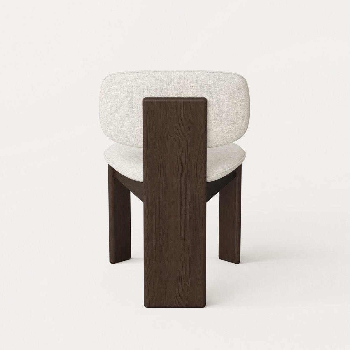 A generously cushioned seat and curved backrest meet rich Dark Oak in Valerio Sommella’s Gaba Dining Chair, showcased by ACERKA Miami.