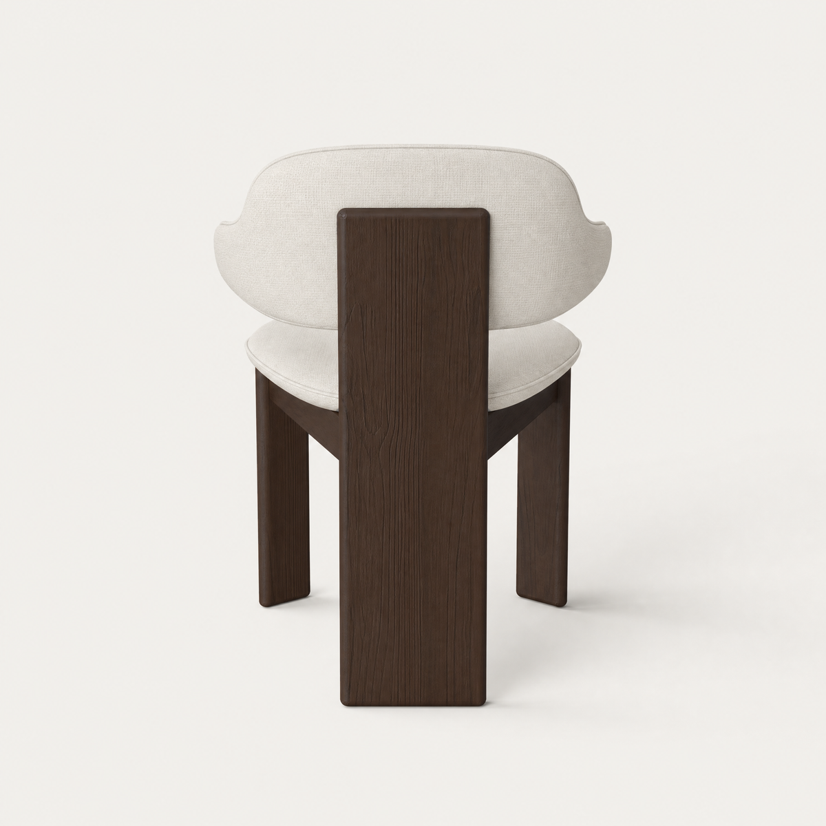 A curved upholstered backrest wraps around the Gaba Dining Armchair by Valerio Sommella, balanced by a solid Dark Oak frame and showcased at ACERKA Miami.