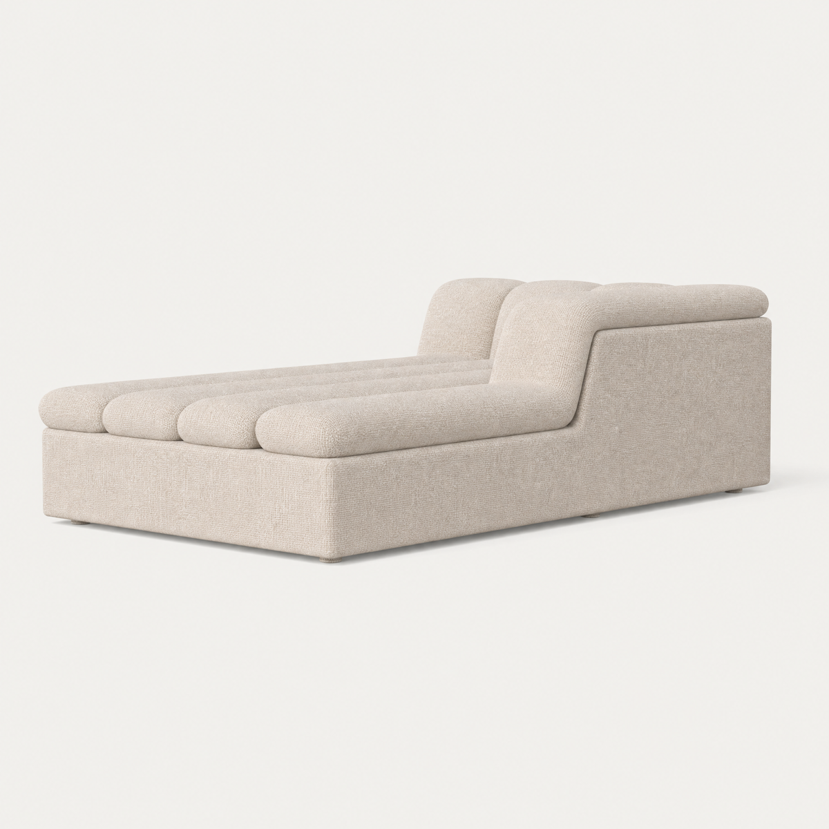 Designed by Valerio Sommella, the Devi Chaise Module combines sculpted cushioning with an elongated form for extended lounging.