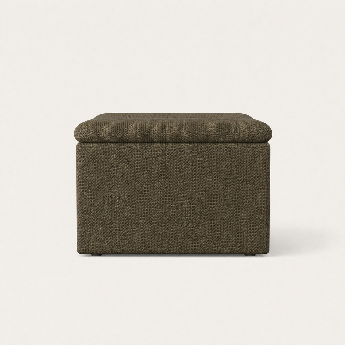 The sculptural Devi Accent Chair combines layered upholstery, rounded edges, and substantial cushioned forms.
