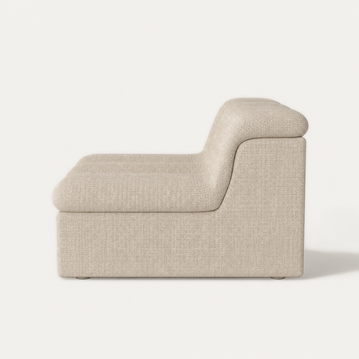 A modern low-profile accent chair with a textured beige fabric upholstery, shown from a side profile view against a clean white background. Designed by Valerio Sommella for Acerka.