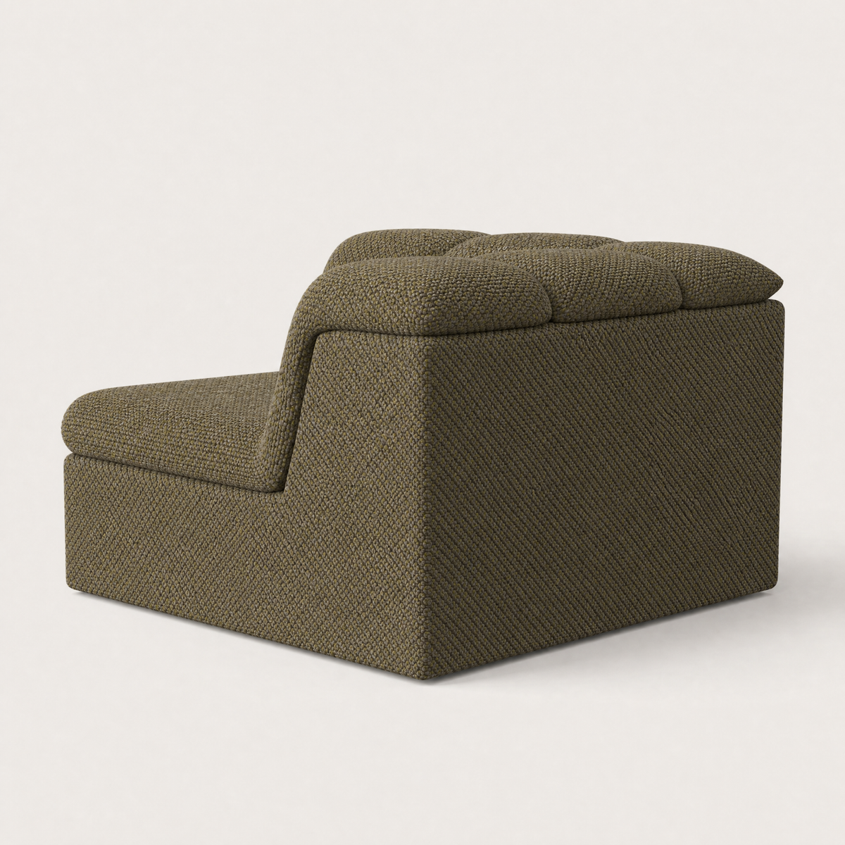 A modern low-profile accent chair in textured olive green fabric, featuring a tufted back cushion and a low backrest, shown from a three-quarters angle on a light gray background. Designed by Valerio Sommella for Acerka.