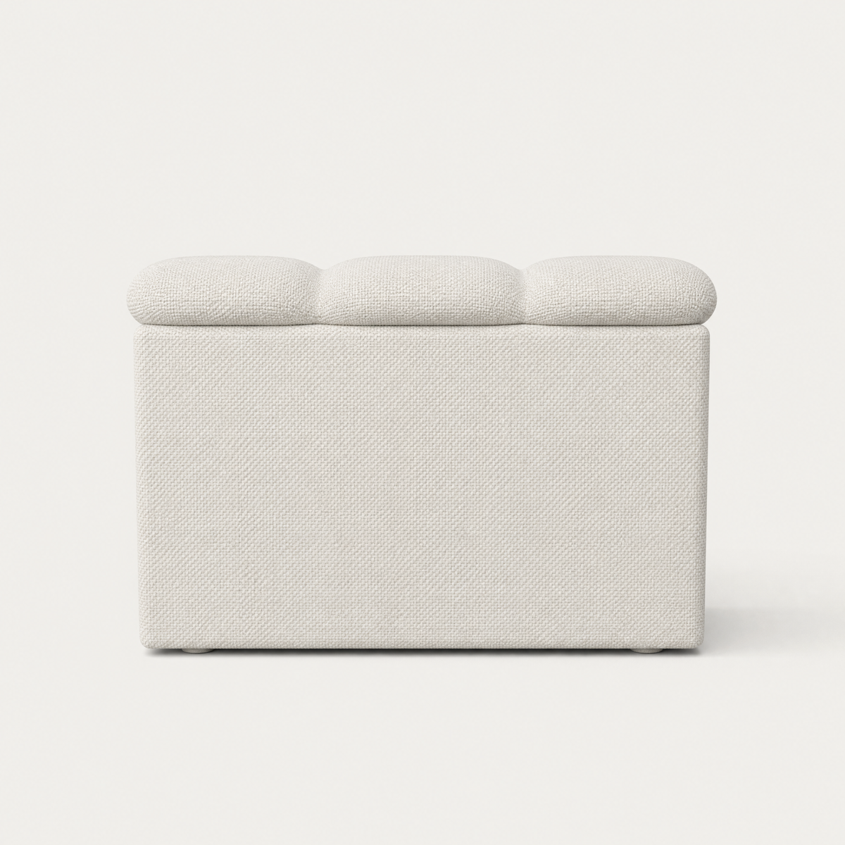 A modern upholstered bench with a textured white fabric and three rounded, tufted cushions on top, shown against a plain white background. Designed by Valerio Sommella for Acerka.