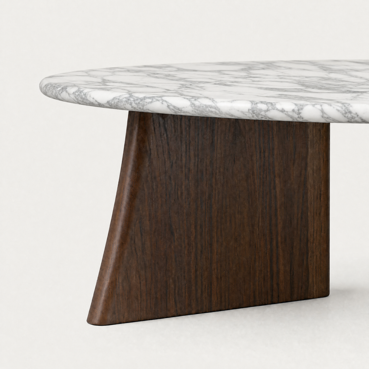 A sculptural architectural base and luxurious marble surface define the Cabo Coffee Table by Francesco Meda, showcased by ACERKA Miami.