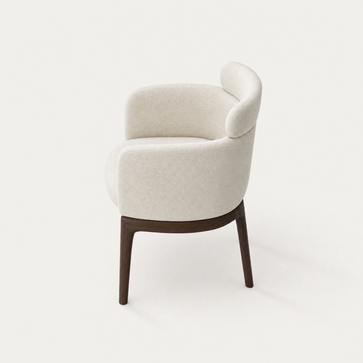 Designed by Ramón Esteve, the Sia Dining Chair brings a distinctive floating lumbar cushion and warm Dark Oak detailing to the ACERKA Miami collection.