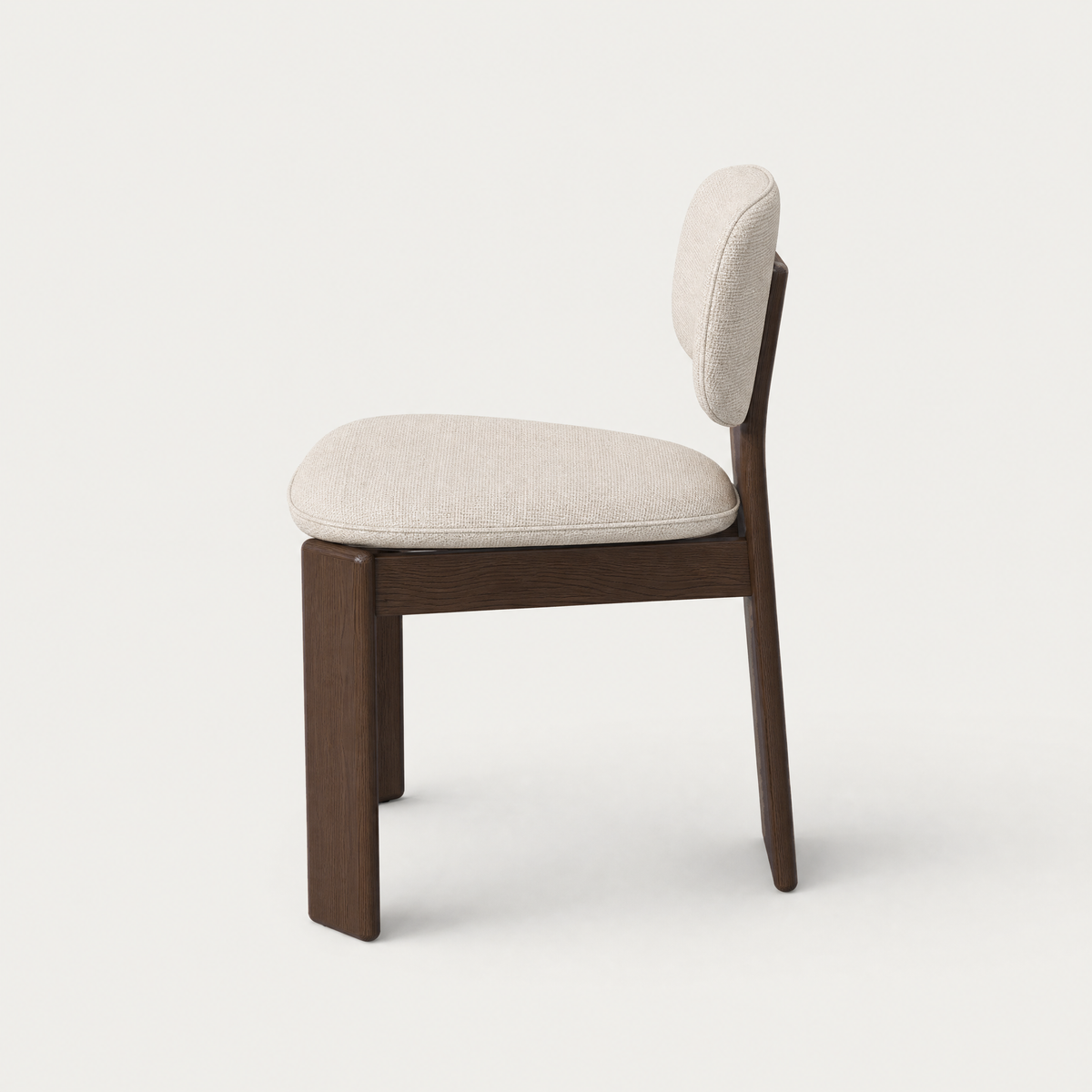 Designed with sculptural simplicity, the Gaba Dining Chair brings Valerio Sommella’s balance of rich Dark Oak and soft upholstery to ACERKA Miami.