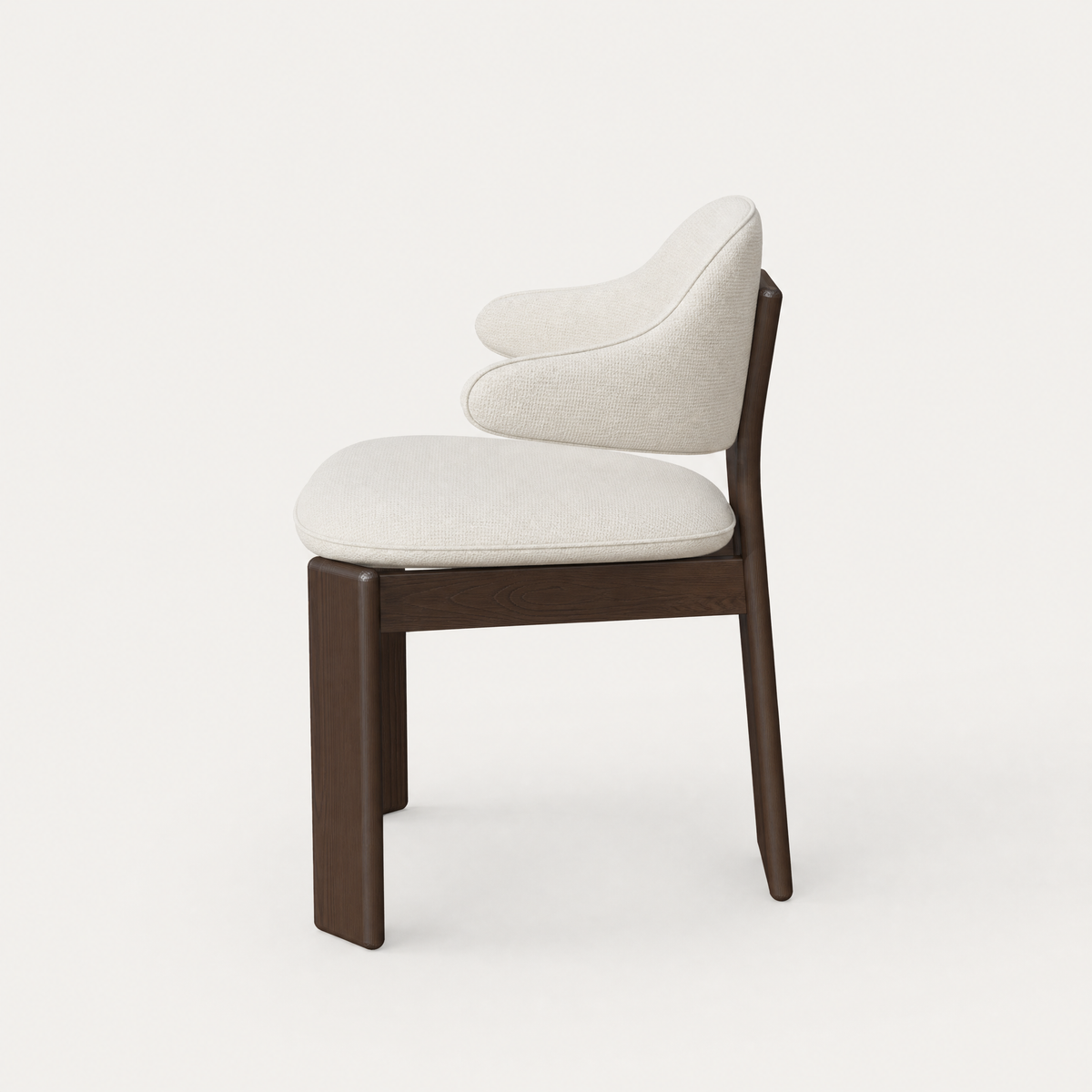 Designed by Valerio Sommella, the Gaba Dining Armchair brings rich Dark Oak, soft upholstery, and architectural proportions to the ACERKA Miami collection.