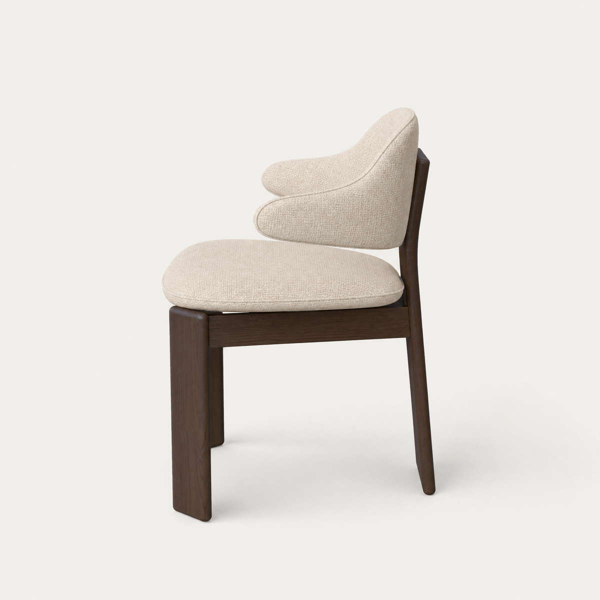 Designed by Valerio Sommella, the Gaba Dining Armchair pairs a curved supportive backrest with rich Dark Oak craftsmanship in the ACERKA Miami collection.