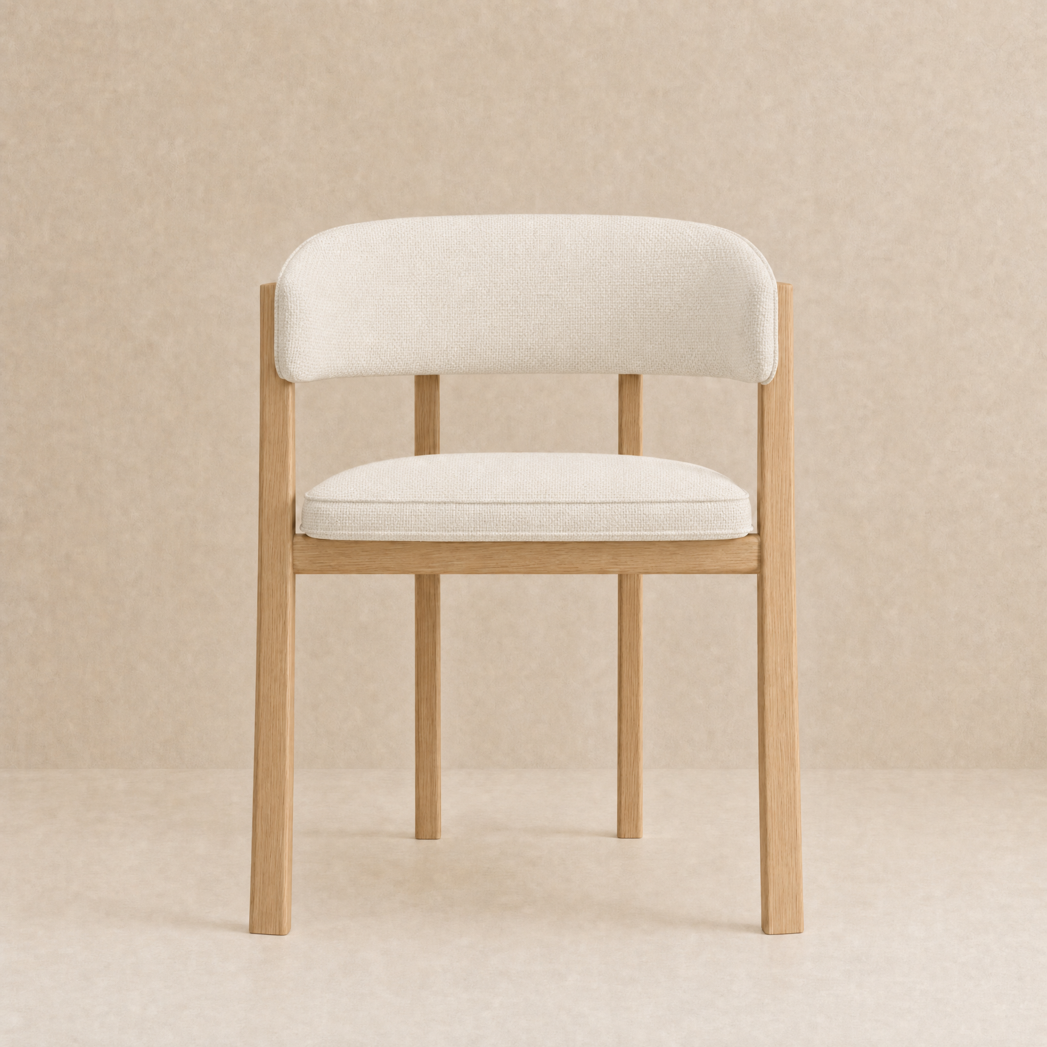 A modern dining chair with a light beige upholstered seat and curved backrest, supported by a natural oak wood frame, set against a neutral beige textured background.