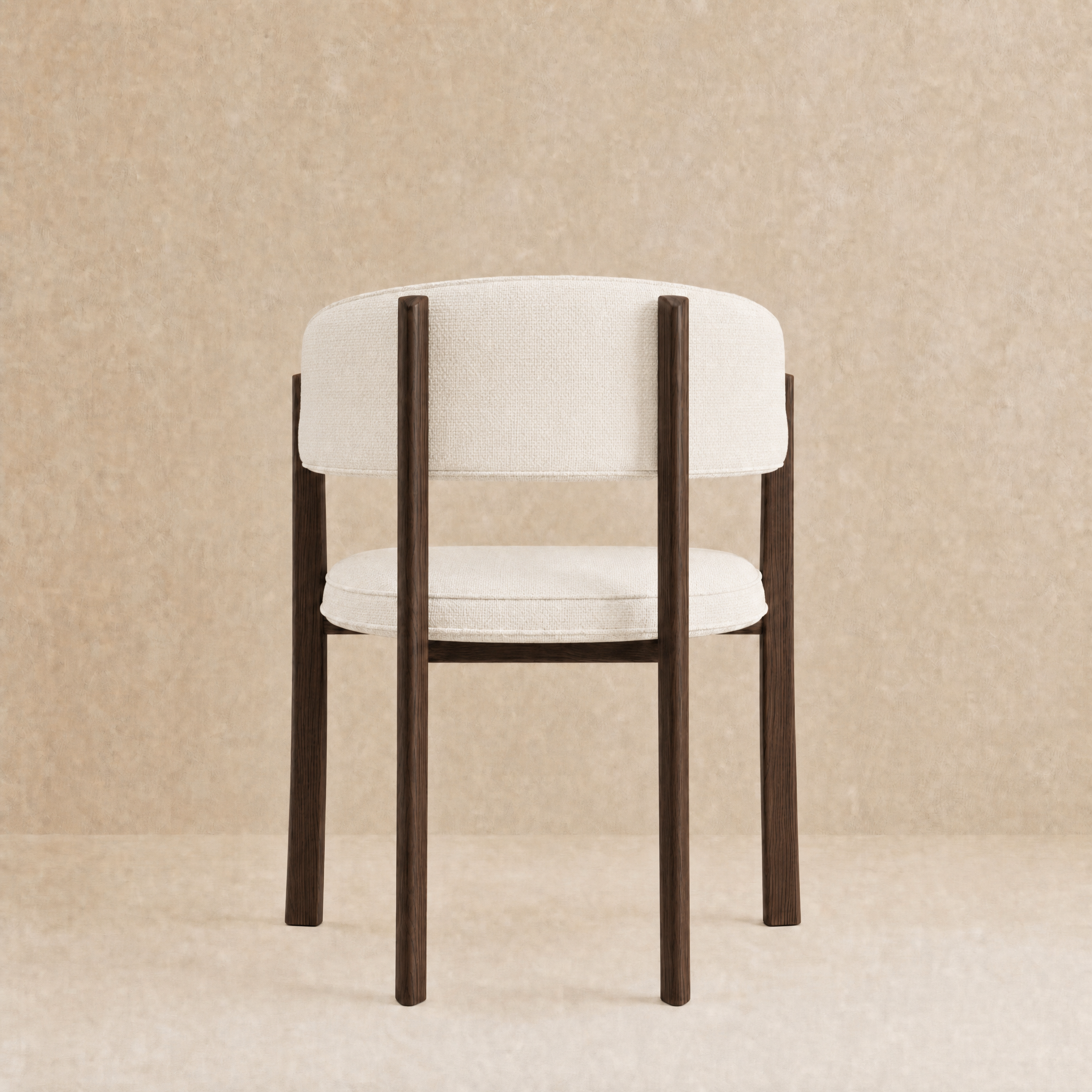 A modern dining chair with a curved white upholstered backrest and seat cushion, supported by four dark brown wooden legs, shown against a textured beige background.