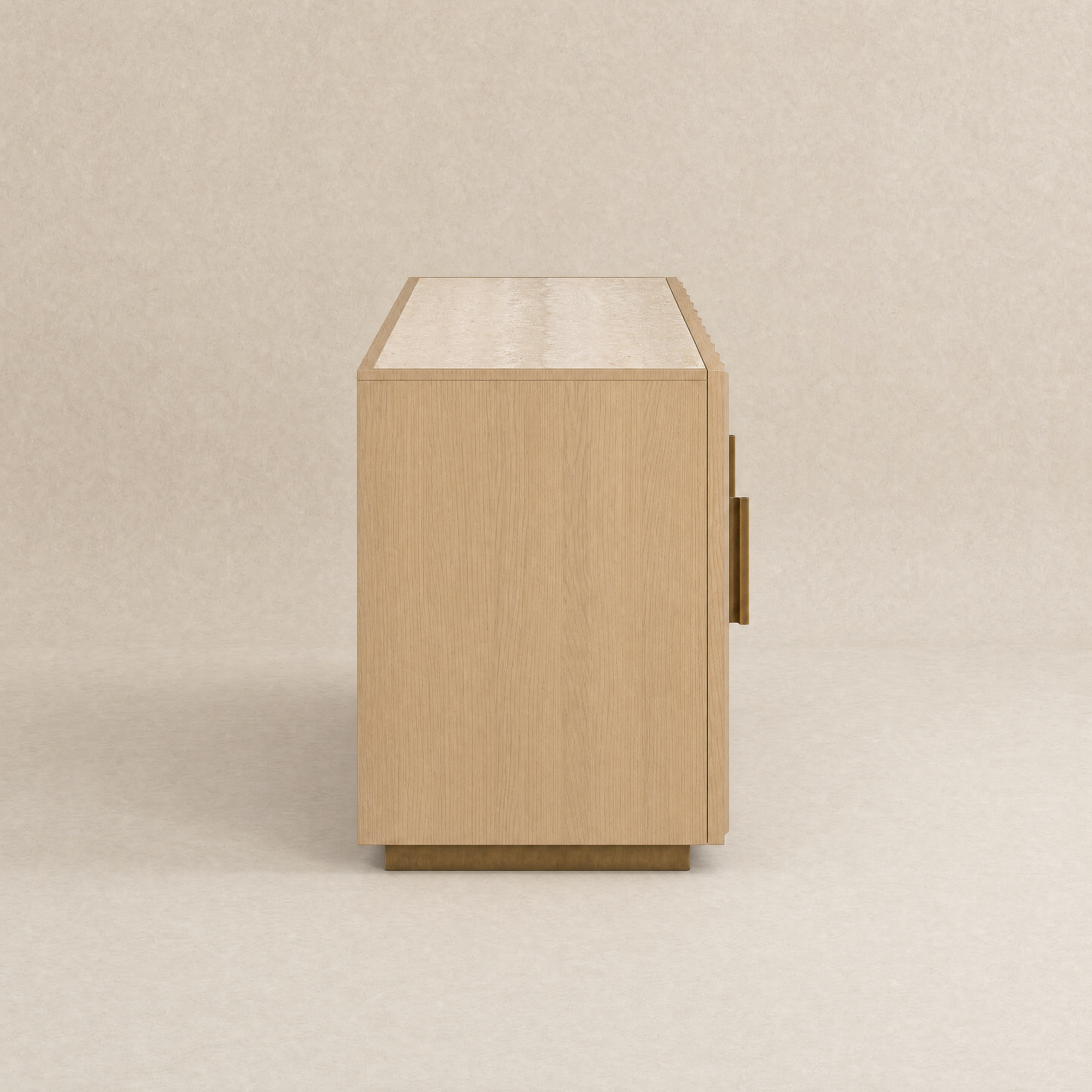 A light oak wood sideboard cabinet shown from a side profile view, featuring a single brass pull handle and a matching brass base, set against a neutral beige textured background.