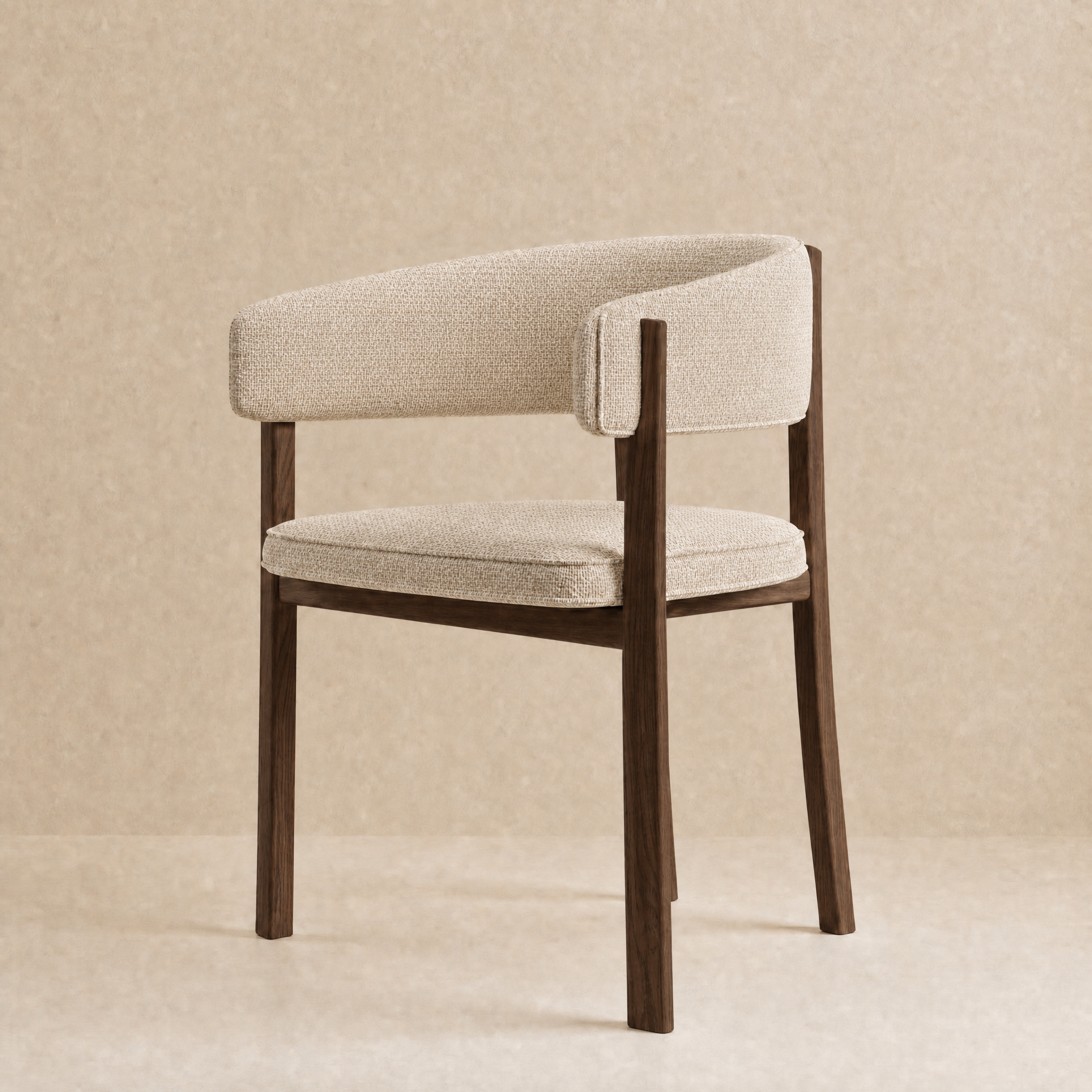 A modern accent chair with a curved upholstered backrest and seat cushion, featuring a dark brown wooden frame and legs, set against a textured beige background.