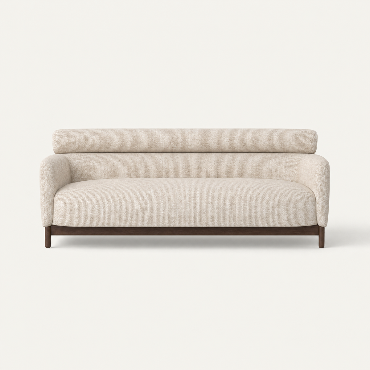 The Sia Medium Sofa by Ramón Esteve features Stone Beige upholstery, a deep continuous seat, and a sculptural Dark Oak base, available at ACERKA Miami.