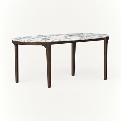 ACERKA Miami showcases the Tcha Dining Table, pairing a softly rounded Italian Arabescato marble top with a slender Dark Oak frame.