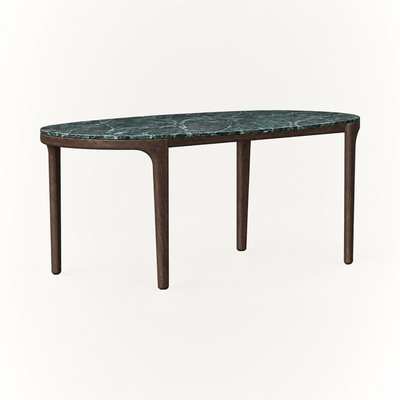 The Tcha Dining Table features a richly veined Verde Alpi marble top and slender Dark Oak legs, creating a striking profile at ACERKA Miami.