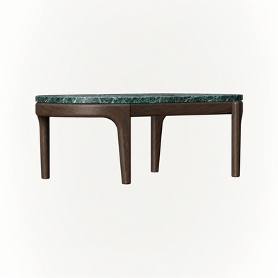 A generous tabletop and meticulously crafted base define the Tcha Low Coffee Table, creating a refined centerpiece showcased by ACERKA Miami.