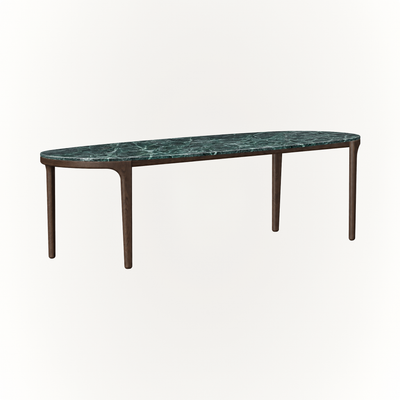 The Tcha Dining Table balances the bold veining of Verde Alpi marble with slender Dark Oak proportions for a contemporary dining centerpiece, showcased by ACERKA Miami.