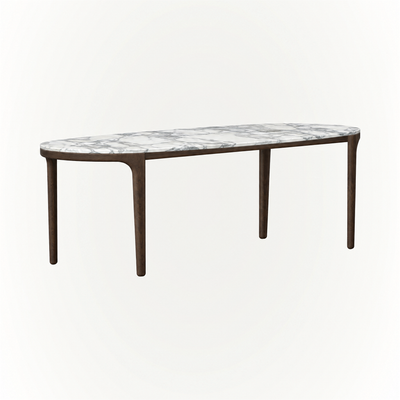 ACERKA Miami presents the Tcha Dining Table, featuring an elongated Italian Arabescato marble top supported by a slender Dark Oak frame and four-leg base.