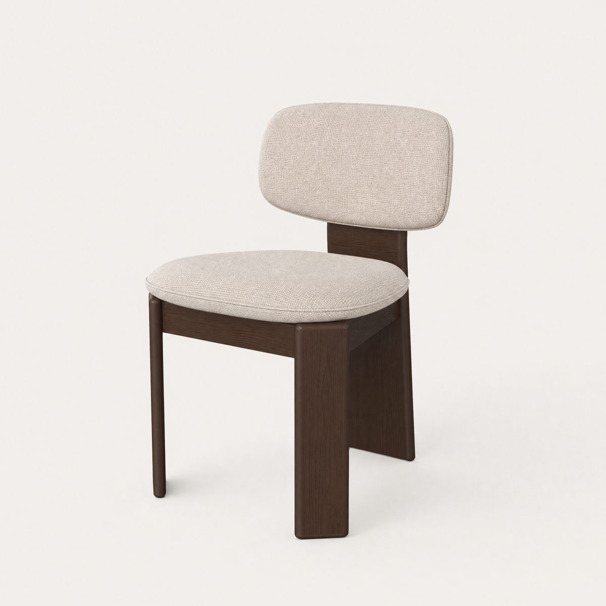 The Gaba Dining Chair by Valerio Sommella features a softly curved upholstered backrest and solid Dark Oak frame, available at ACERKA Miami.