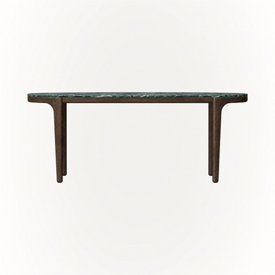 Deep green stone and rich Dark Oak meet in the Tcha Dining Table at ACERKA Miami, shaped with softly rounded edges and a slender architectural frame.