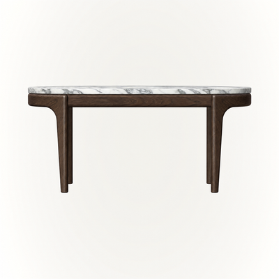 The Tcha High Coffee Table by Ramón Esteve highlights the organic texture and tonal variation of Italian Light Travertine, available at ACERKA Miami.