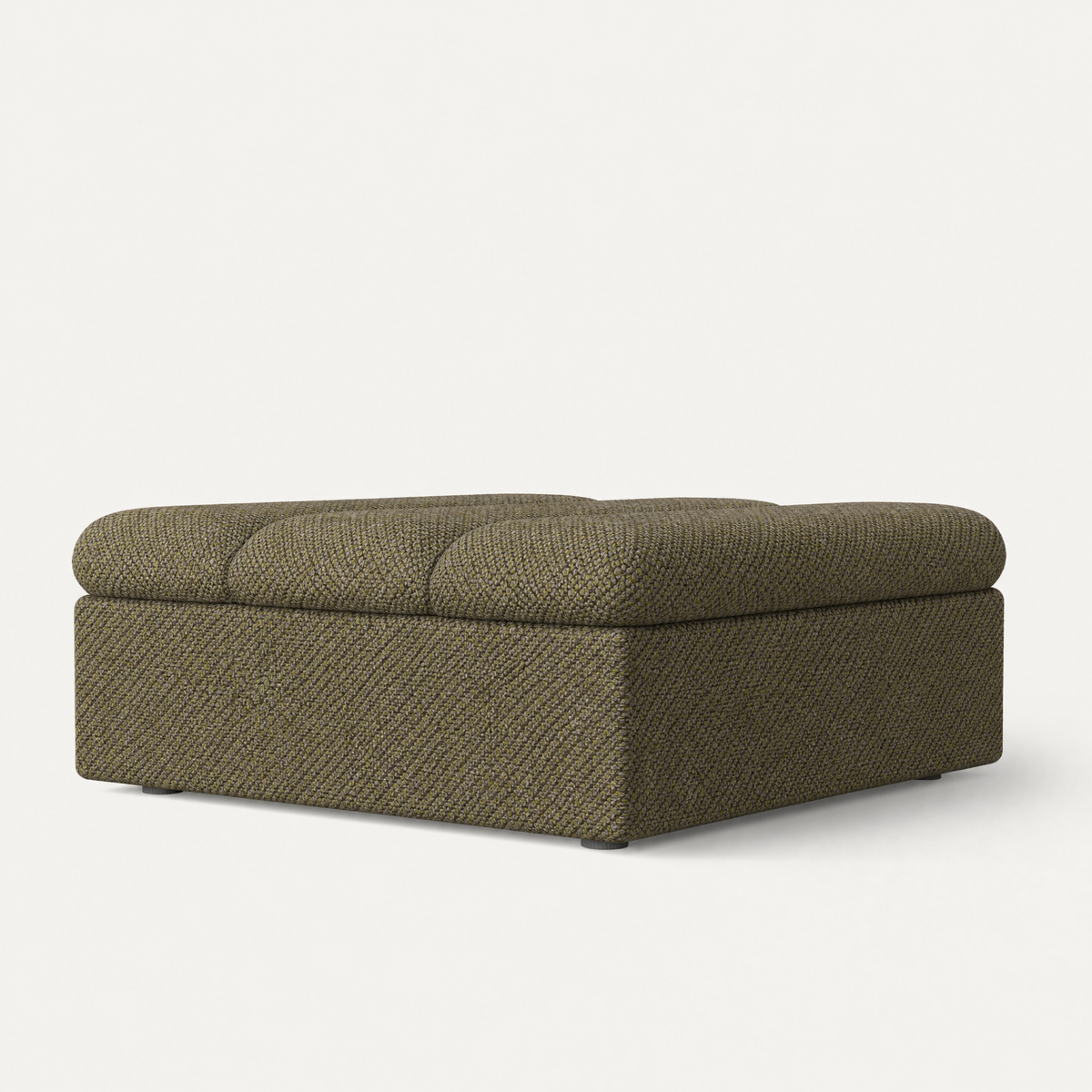 A square upholstered ottoman with a tufted cushioned top and textured fabric, shown on a clean off-white background. Designed by Valerio Sommella for Acerka.