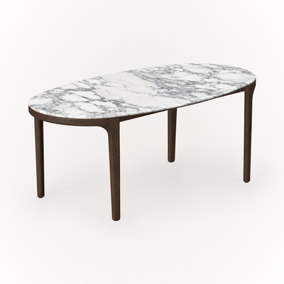 Expressive Arabescato marble gives the Tcha Dining Table its distinctive surface, balanced by streamlined Dark Oak legs and available at ACERKA Miami.