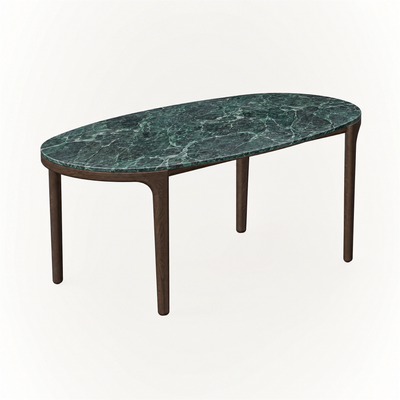 ACERKA Miami showcases the Tcha Dining Table, where deep green Verde Alpi marble contrasts with a streamlined four-leg Dark Oak frame.
