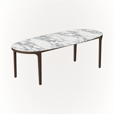 Crafted with an elongated rounded marble top and slender oak legs, the Tcha Dining Table brings an architectural silhouette to the ACERKA Miami collection.