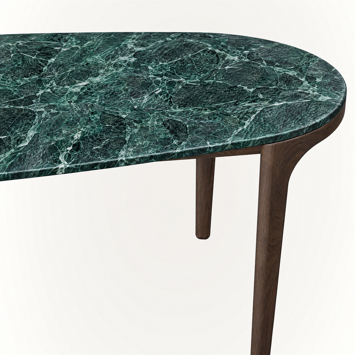Dramatic natural veining defines the Verde Alpi marble top of the Tcha Dining Table, balanced by a visually light Dark Oak frame and showcased at ACERKA Miami.