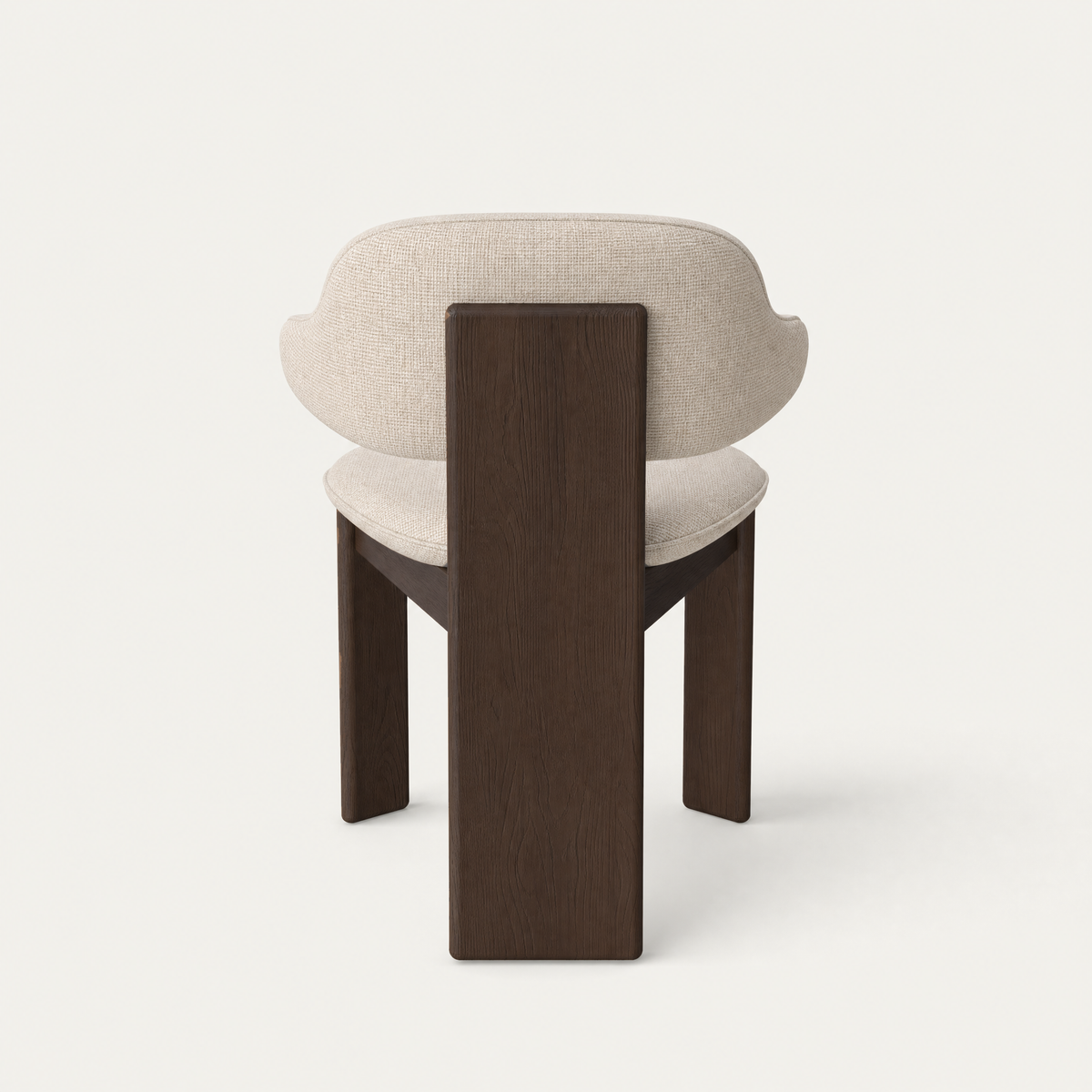 Soft upholstery wraps around the Gaba Dining Armchair by Valerio Sommella, while its solid oak frame brings sculptural definition to ACERKA Miami.