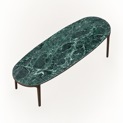 The Tcha Dining Table combines an elongated rounded Verde Alpi marble top with streamlined Dark Oak legs, bringing architectural character to the ACERKA Miami collection.
