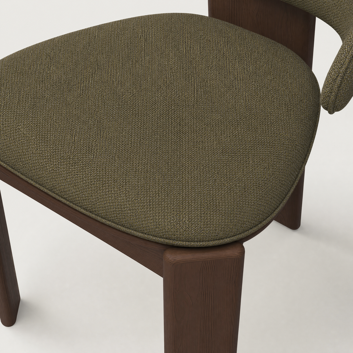 Available in Alpine White, Stone Beige, and Olive Green, ACERKA Miami’s Gaba Dining Armchair features soft upholstery set against a rich Dark Oak frame.