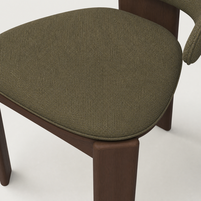 Available in Alpine White, Stone Beige, and Olive Green, ACERKA Miami’s Gaba Dining Armchair features soft upholstery set against a rich Dark Oak frame.
