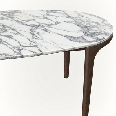 Italian Arabescato marble contrasts with slender Dark Oak proportions in ACERKA Miami’s Tcha Dining Table, creating a substantial yet visually light silhouette.
