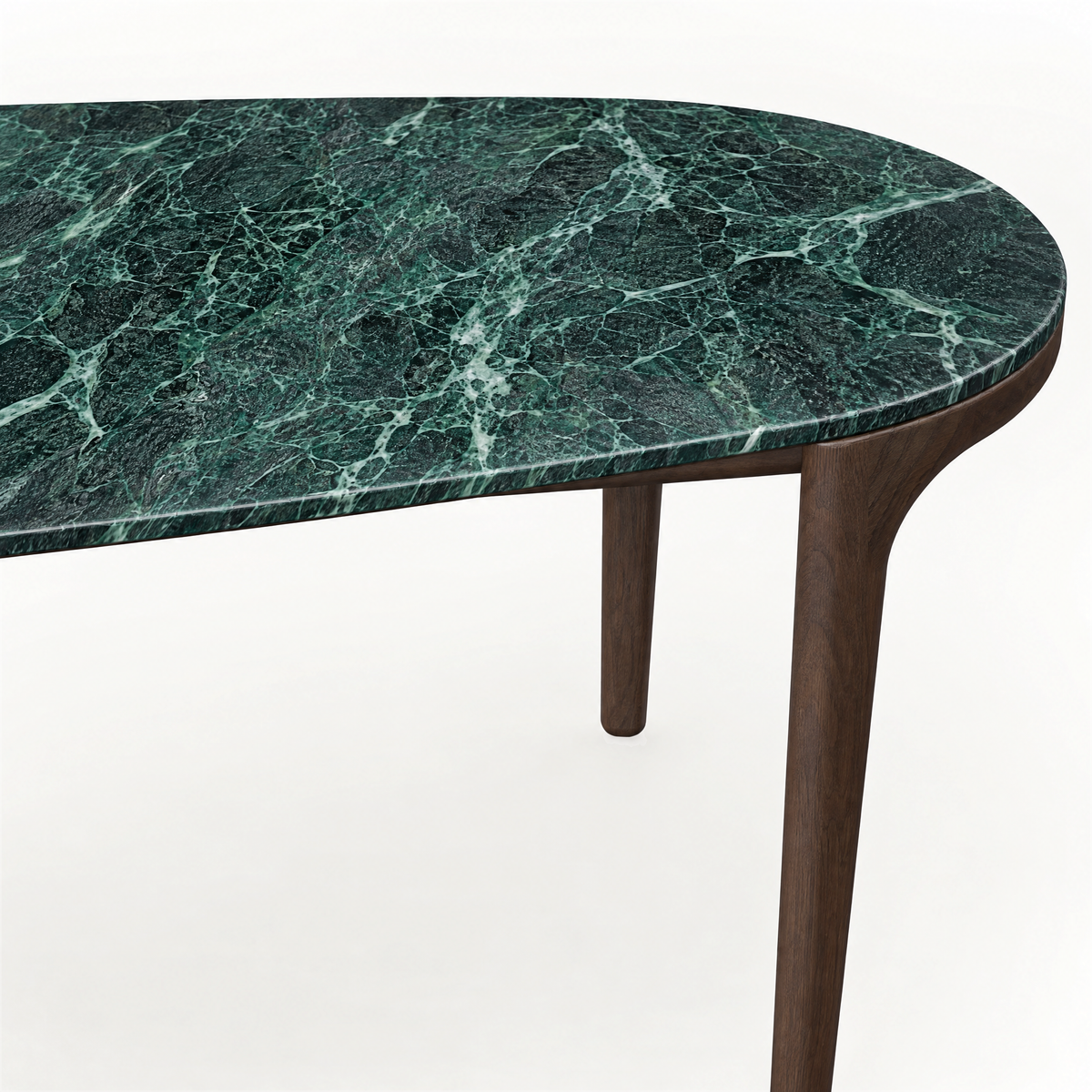 Deep green marble gives the Tcha Dining Table its striking natural character, while a slender Dark Oak frame creates visual balance at ACERKA Miami.