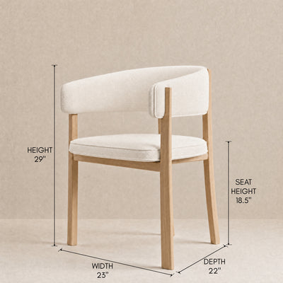 A light wood dining chair with cream upholstered seat and back, shown with dimension callouts for height, seat height, width, and depth on a neutral beige background.