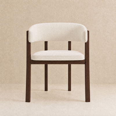 A modern accent chair with a curved backrest and seat cushion upholstered in off-white fabric, supported by a dark brown wooden frame, set against a neutral beige textured background.